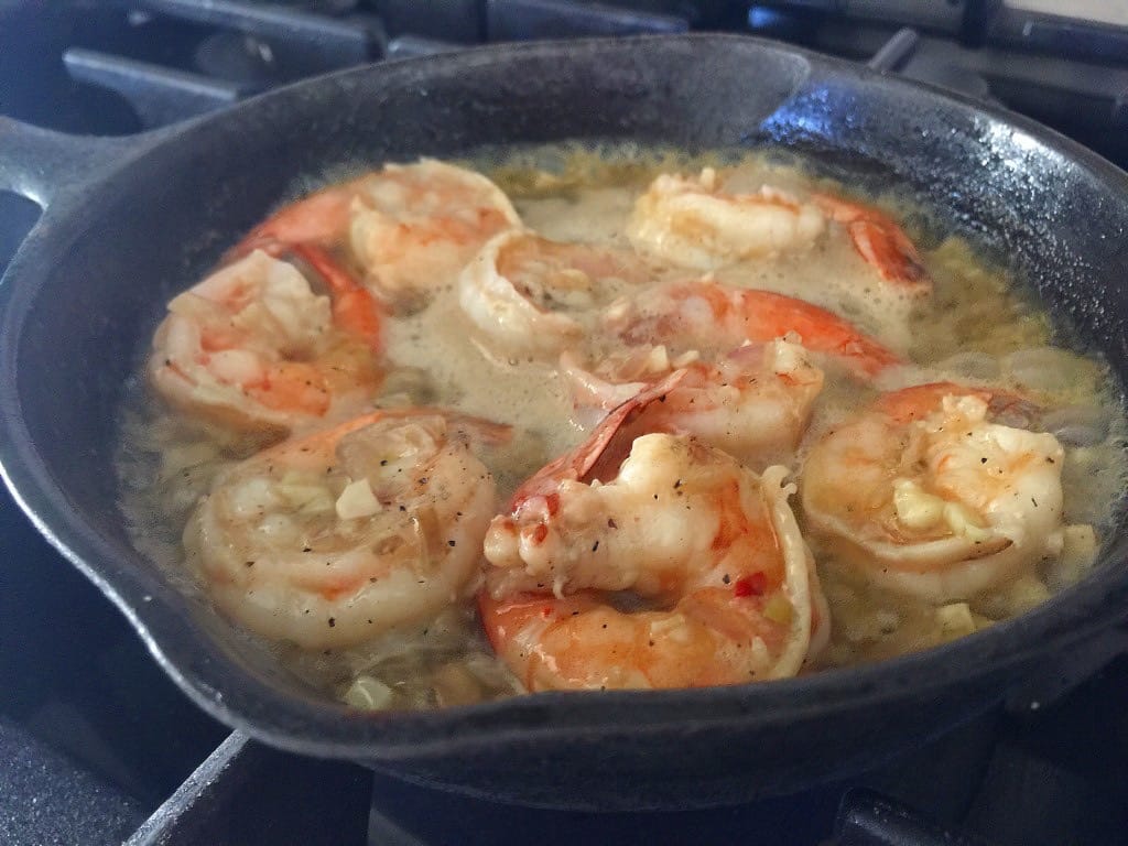 Cast Iron full of cooked shrimp