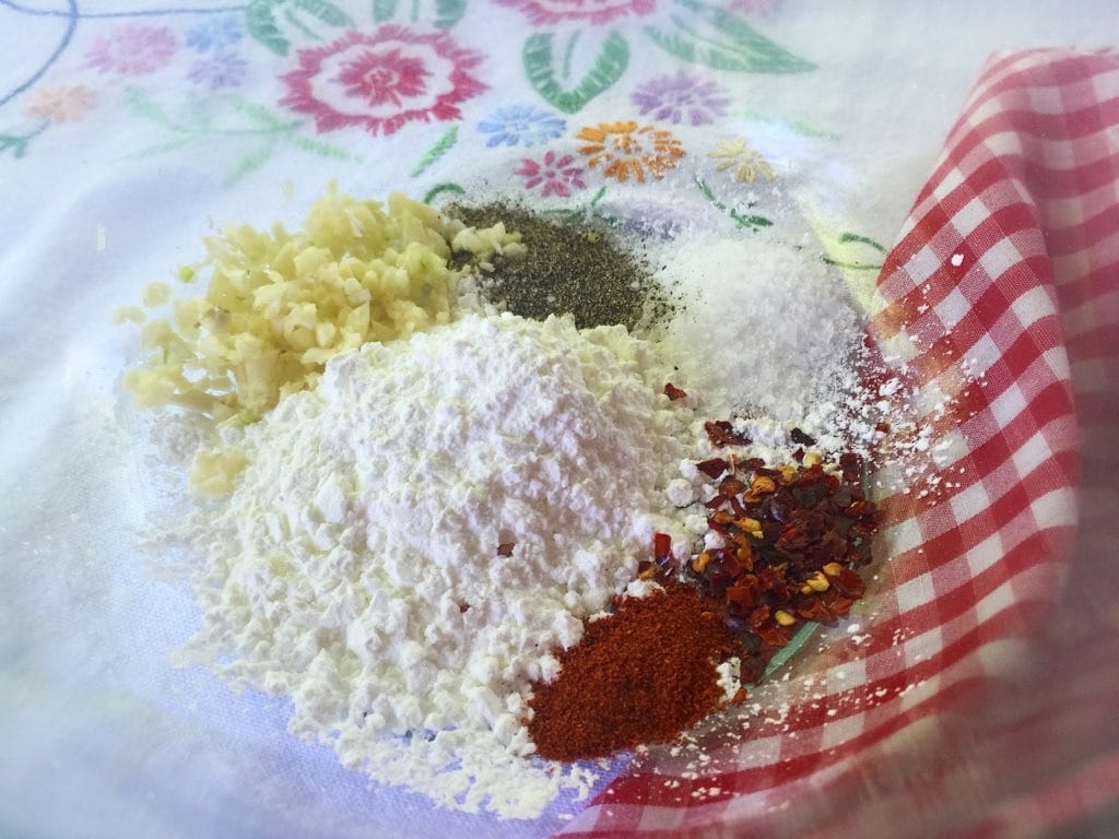 a bowl full of spices and garlic
