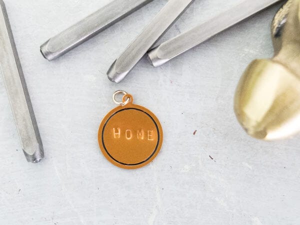 making a copper keychain with letter spikes and a hammer