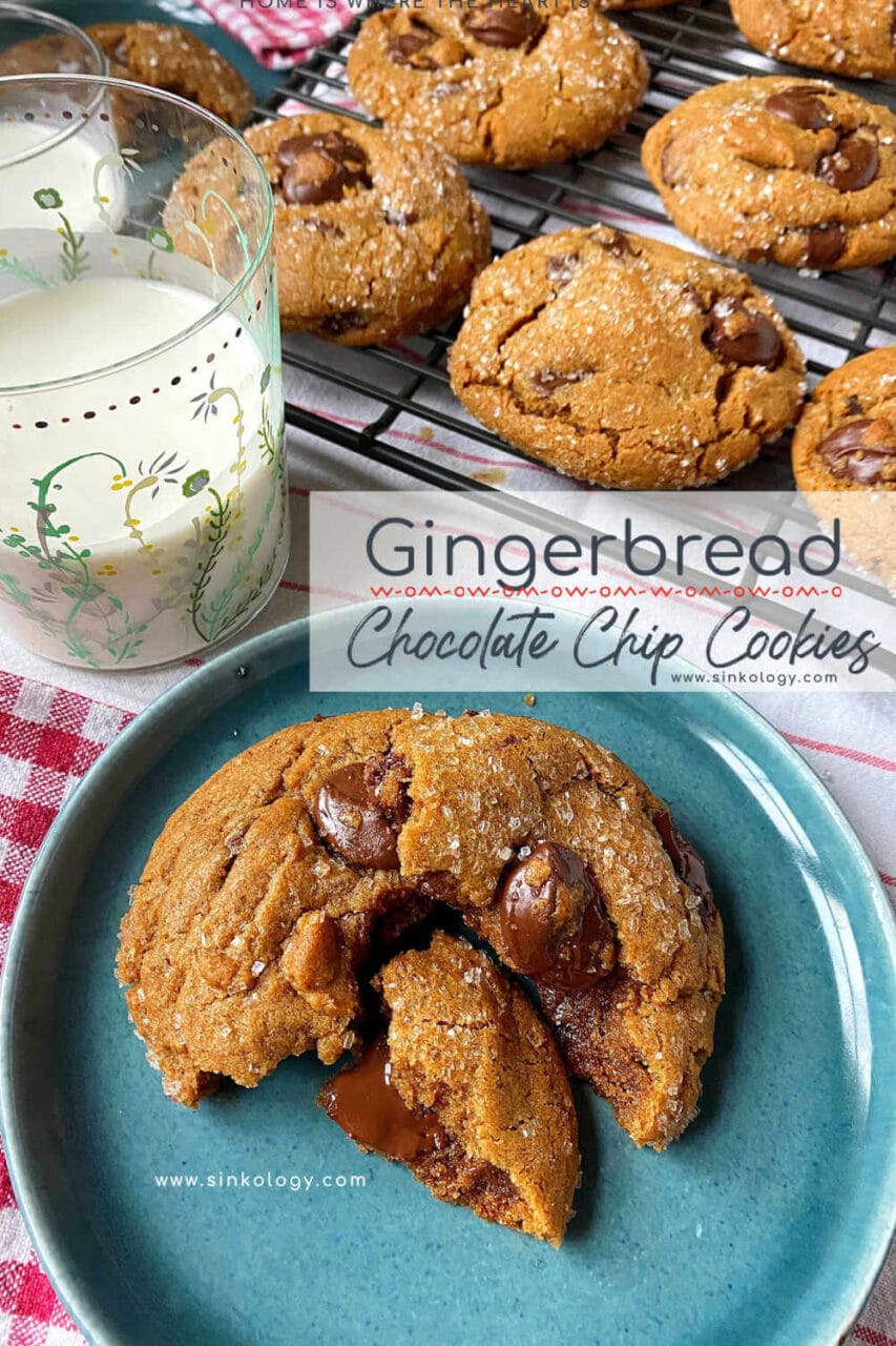 Advertisement for gingerbread chocolate chip cookies from Sinkology, showing a cookie on a blue plate with a glass of milk and more cookies cooling on a wire rack in the background.