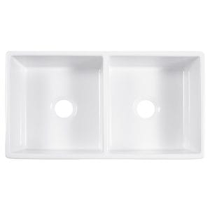 A double basin white fireclay farmhouse kitchen sink.