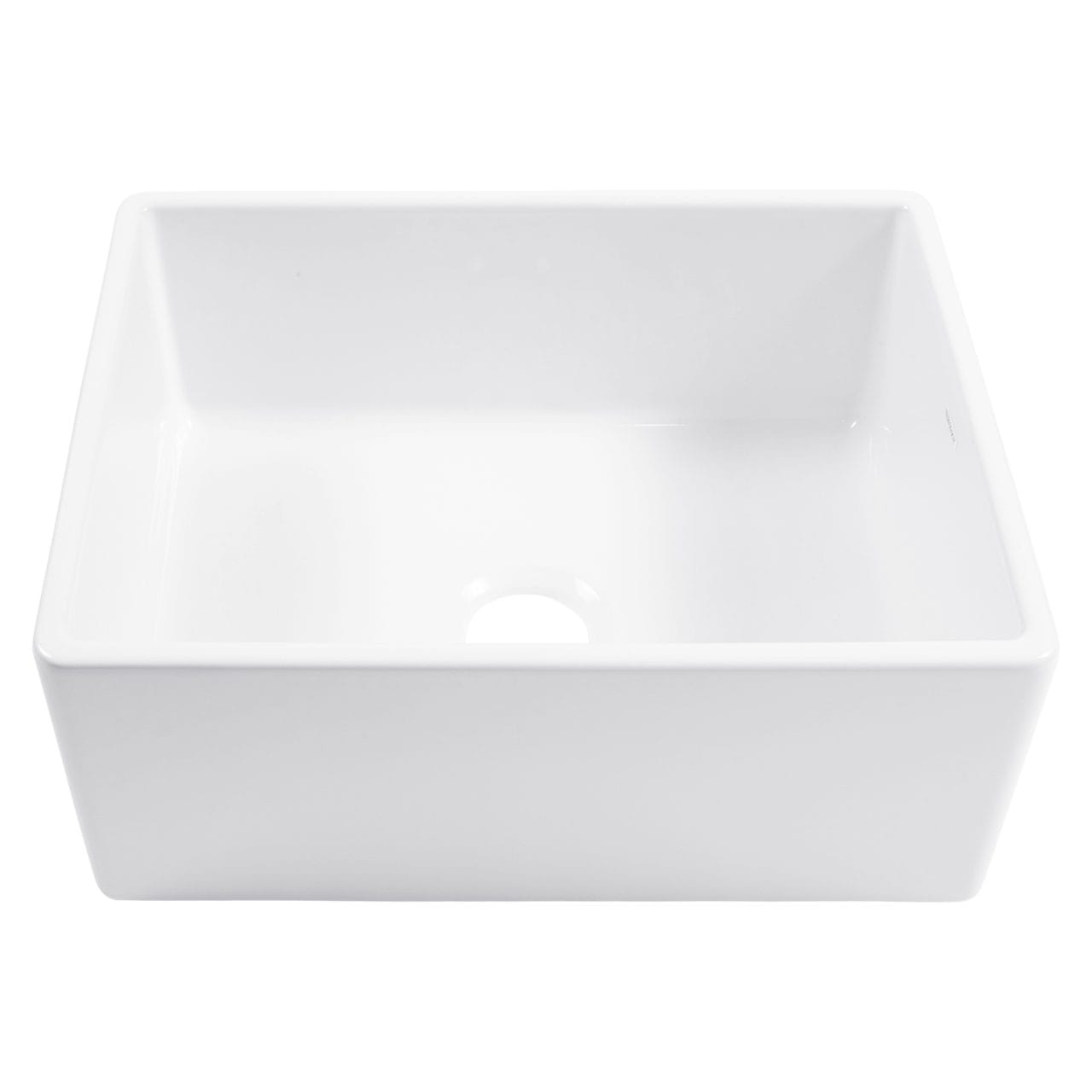 A white fireclay farmhouse kitchen sink.