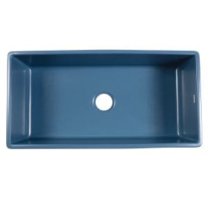 A matte blue fireclay farmhouse kitchen sink.