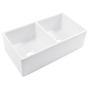 A glossy white rectangular double bowl undermount farmhouse sink made in fireclay.
