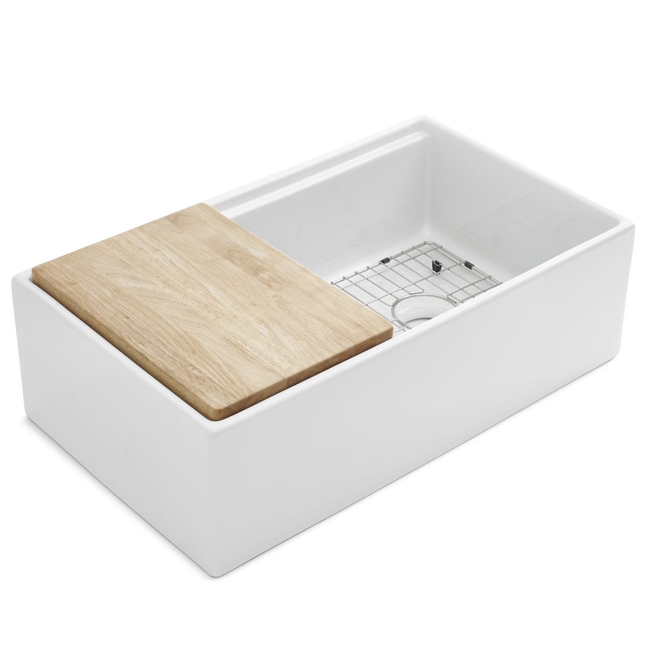 A white fireclay farmhouse workstation kitchen sink with wooden cutting board and stainless steel bottom grid.
