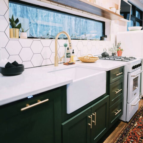 An undermounted white fireclay farmhouse kitchen sink.