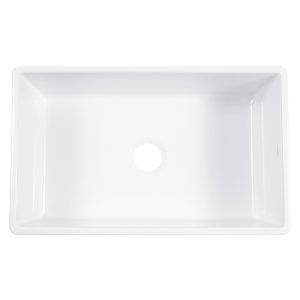 A glossy white rectangular undermount farmhouse sink made in fireclay.