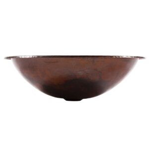 A hand hammered dual mount copper bathroom sink.