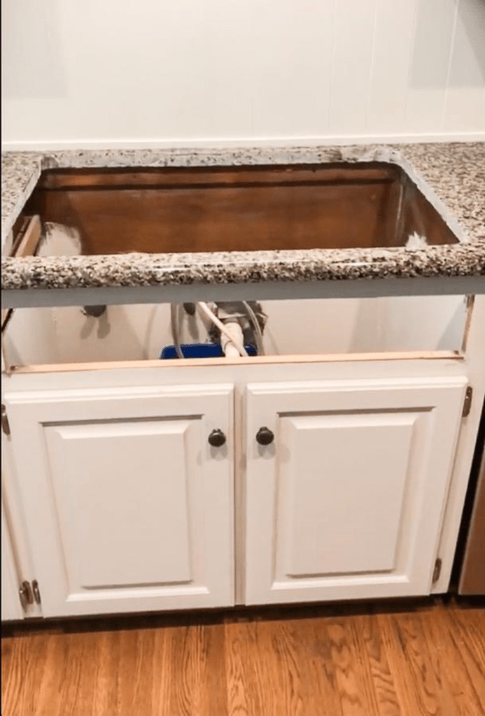 a hole where the old kitchen sink was in the countertop