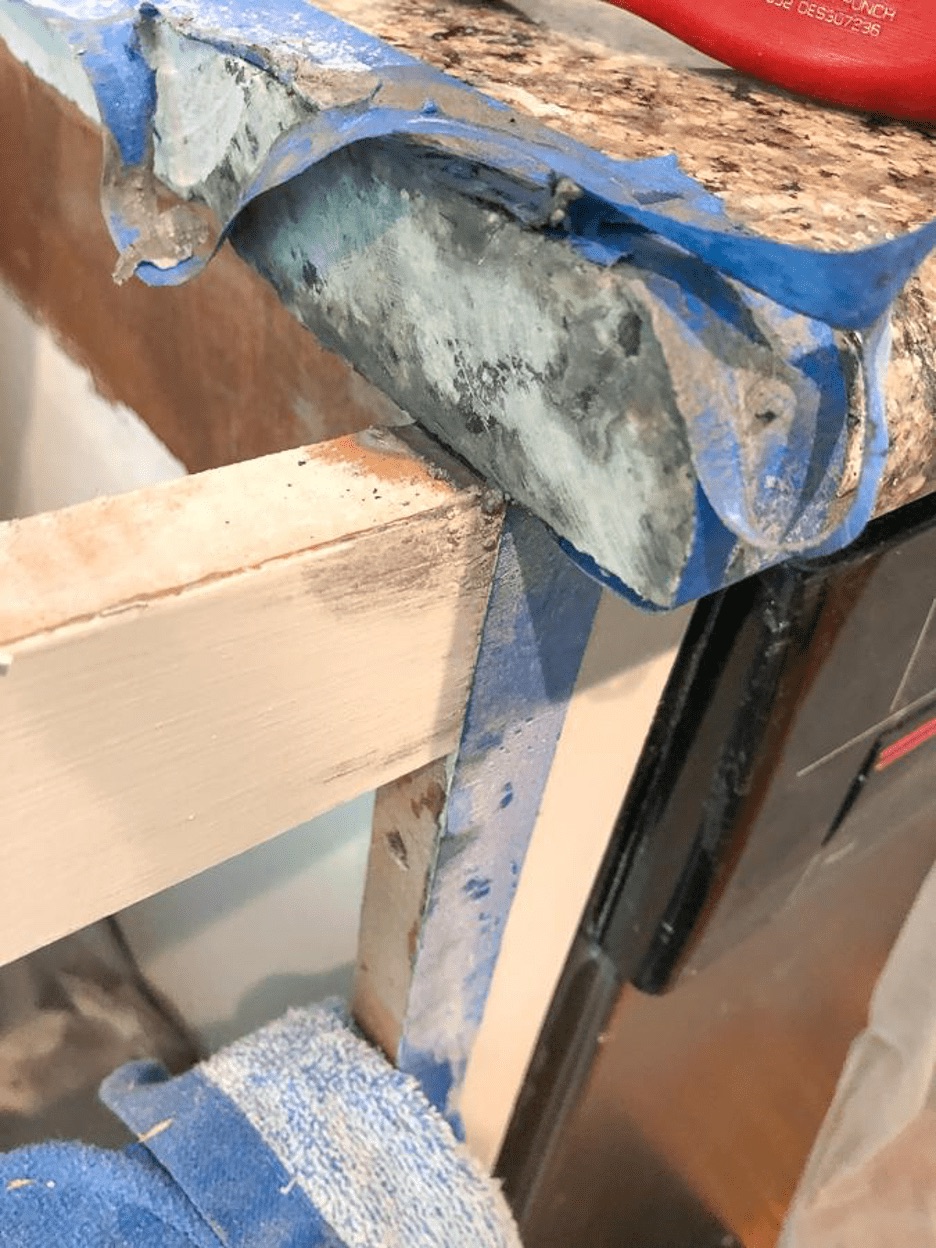towel on cabinet base to protect agains cutting countertop