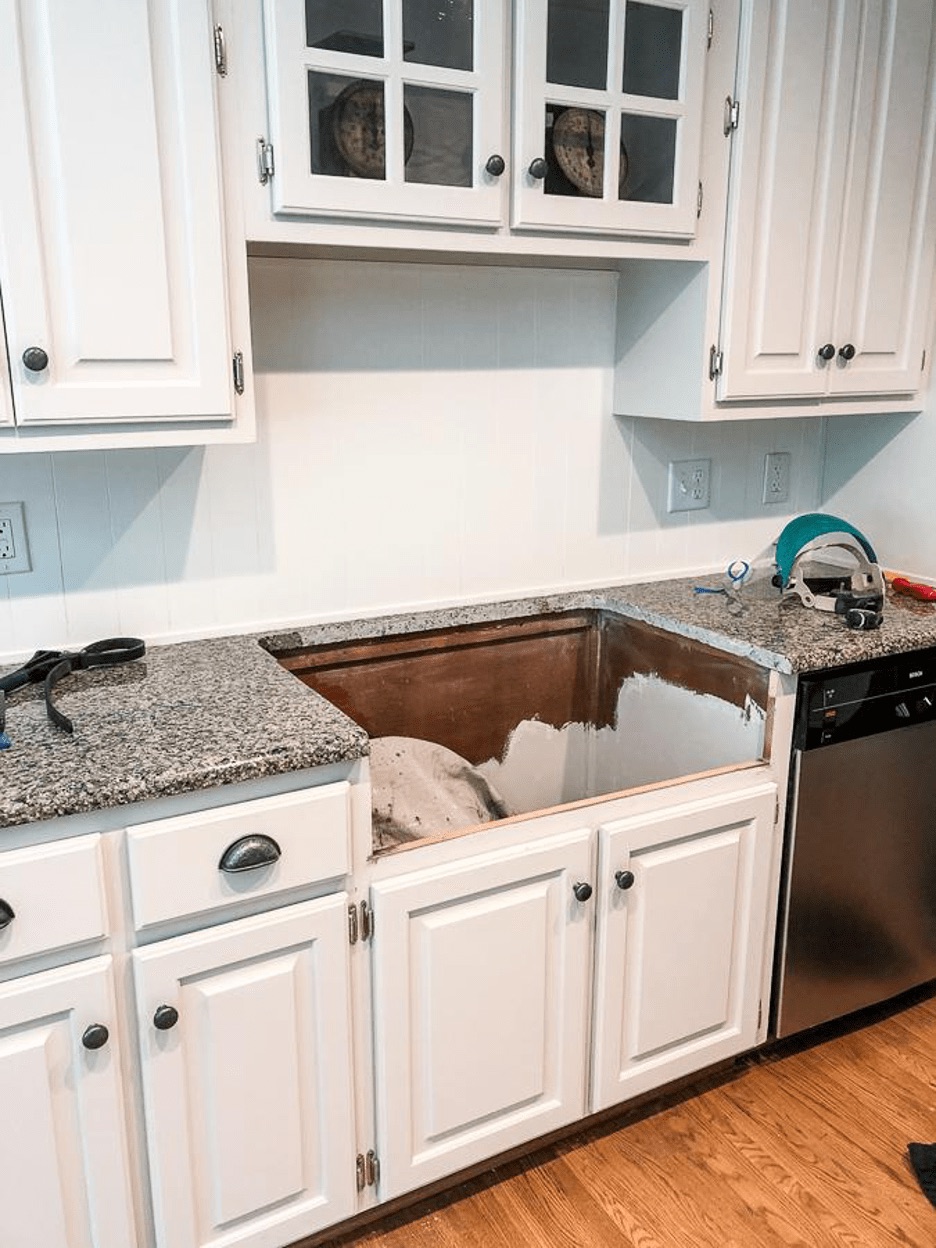 a cabinet base cut and modified to fit new fireclay sink