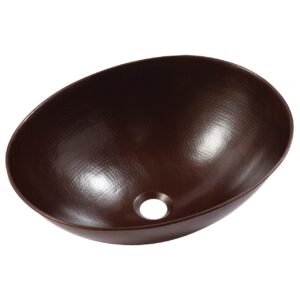 A hand hammered copper vessel bathroom sink.
