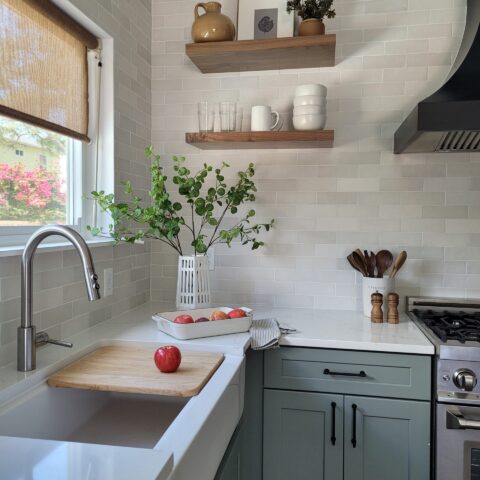 wooden cutting board in workstation sink