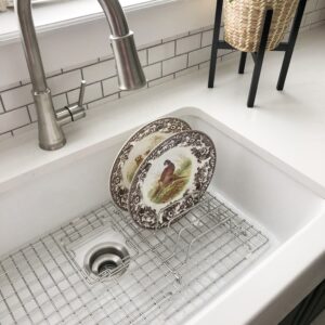 GridLogic Stainless Steel Organizer attached to a bottom grid in a kitchen sink