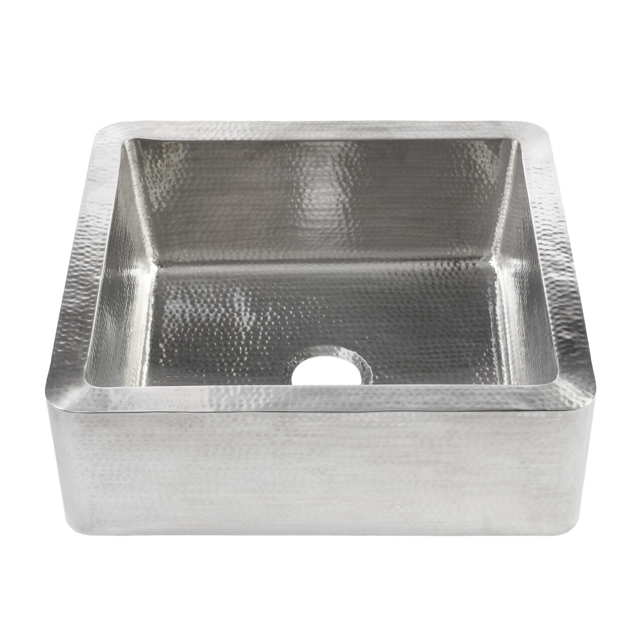 A hand hammered stainless steel farmhouse kitchen sink.
