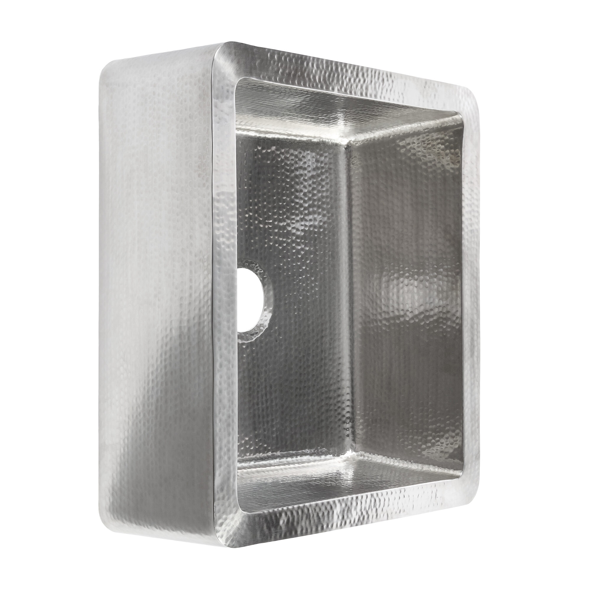 A hand hammered stainless steel farmhouse kitchen sink.