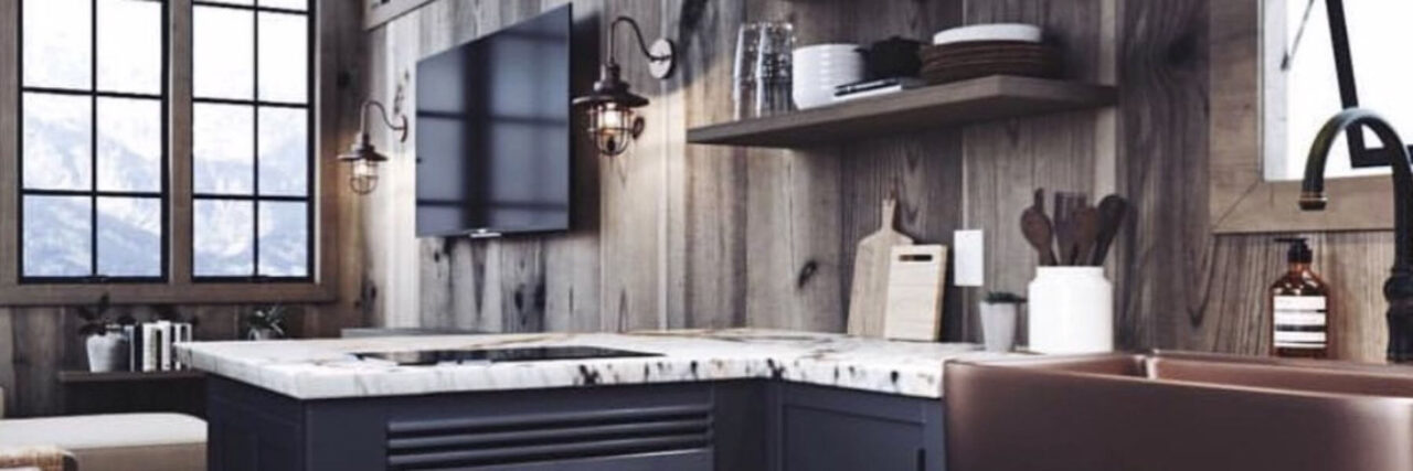 Rustic kitchen with dark cabinetry, a marble countertop, and a copper sink, featuring wooden walls, open shelving with dishes, and large windows providing a mountain view.