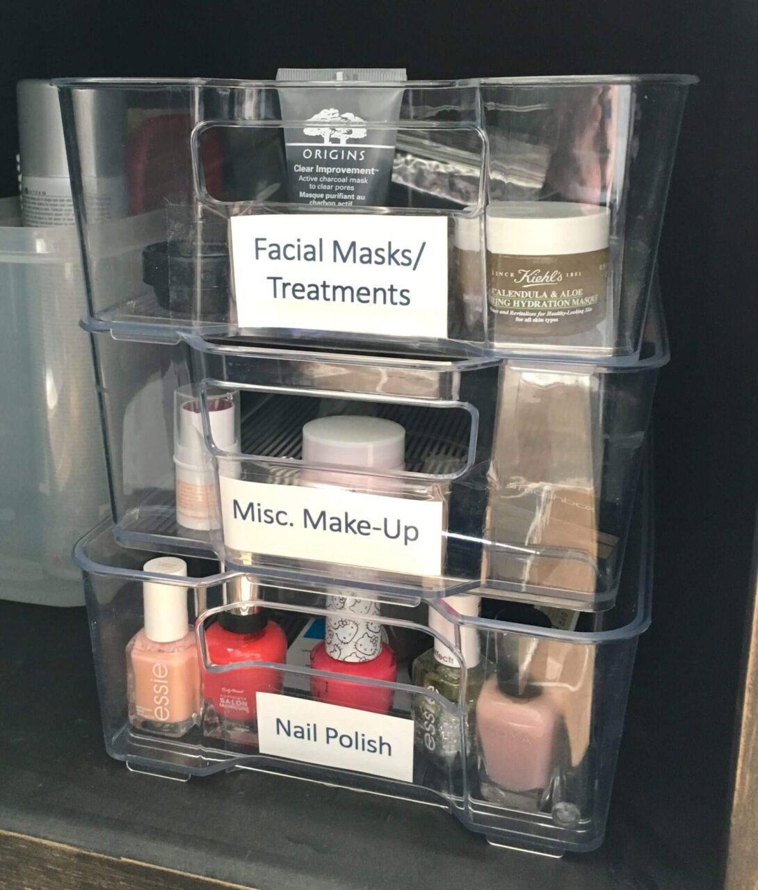 Stackable clear storage containers with labels.